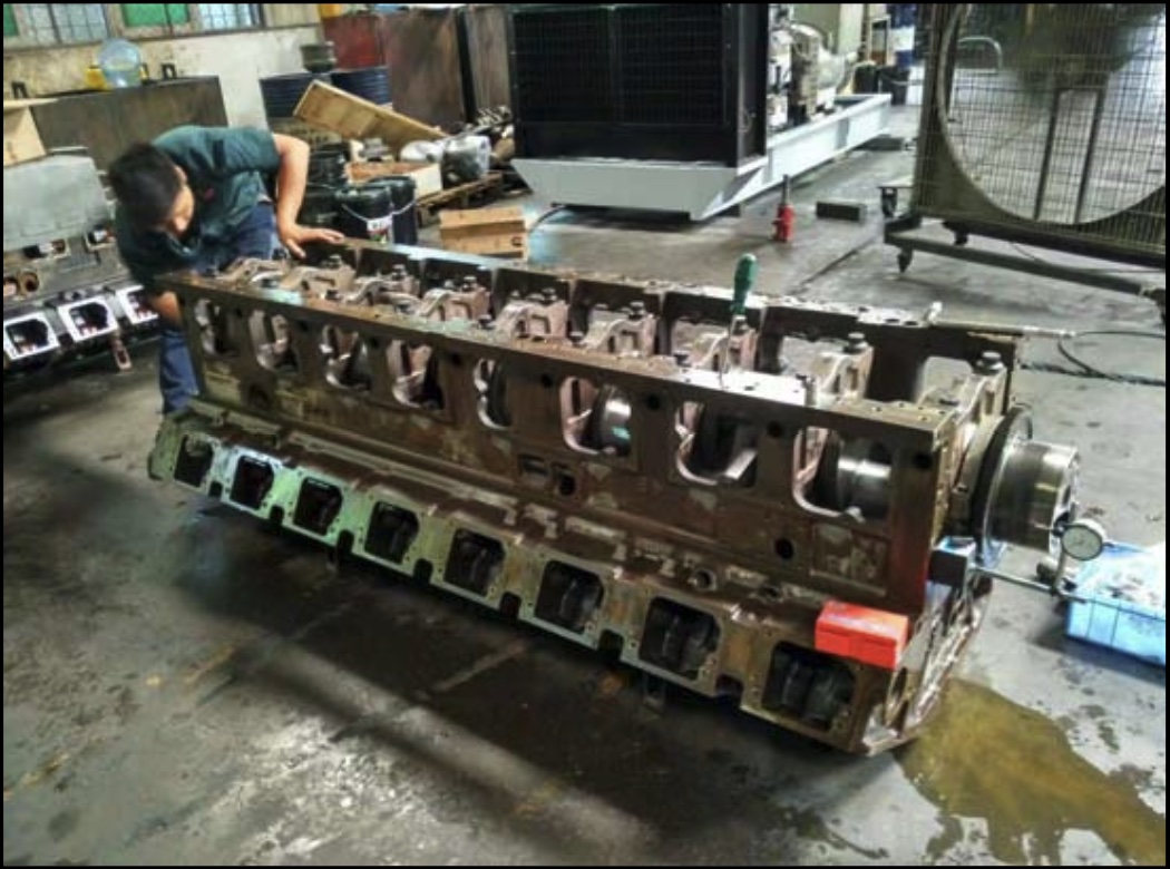The engine undergoes sandblasting before being thoroughly disassembled.